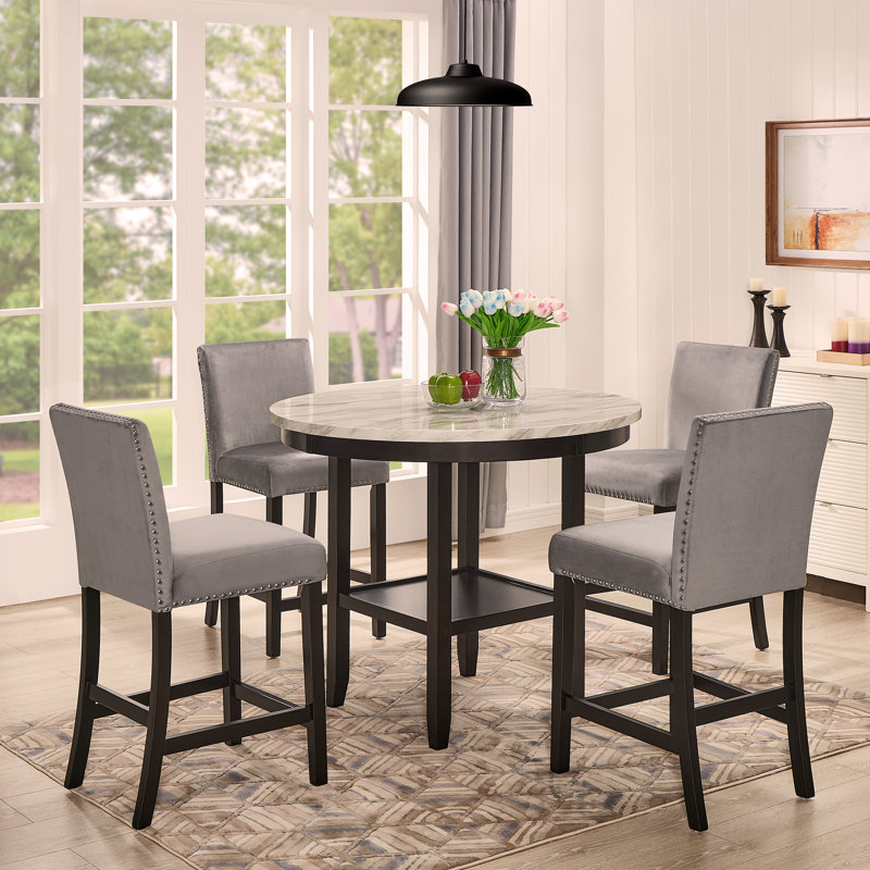 Ensemble de salle à manger 5 pièces à hauteur de comptoir Mella - Table ronde avec 4 tabourets Parsons en velours gris