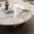 39" Round Stone Coffee Table with Metal Cylinder Legs - Modern Luxury, Space-Saving Design