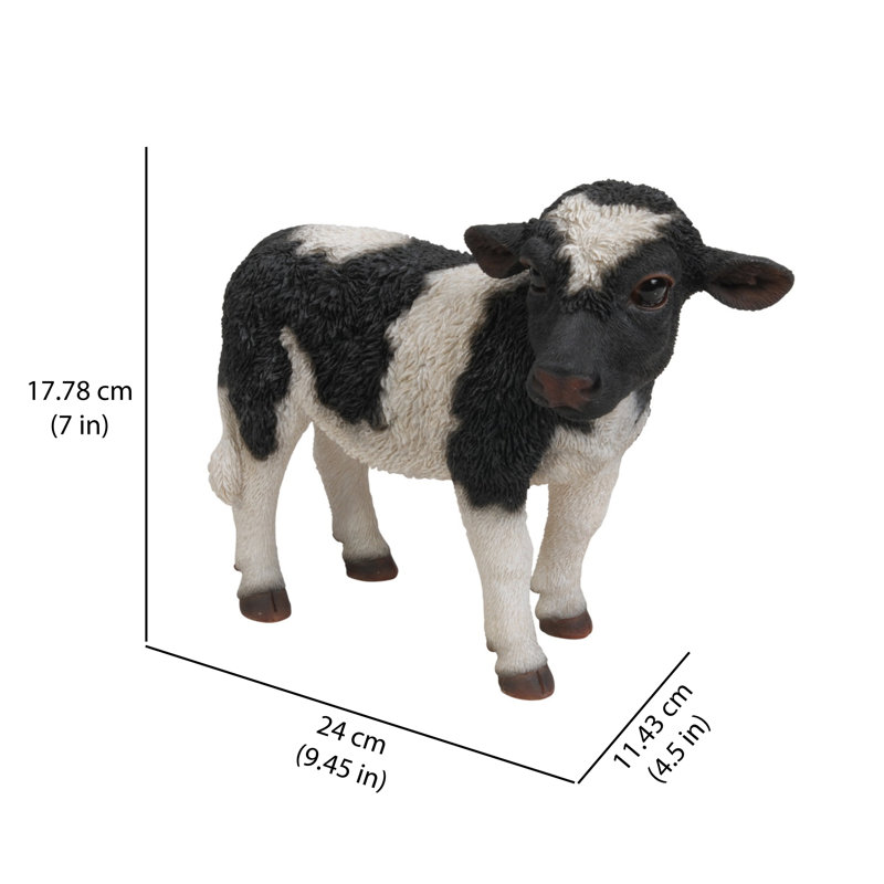 Statue de vache debout noir et blanc