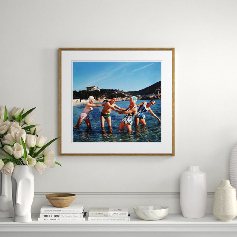 Three Happy Women And A Man Playing In The Water Giclee Print by Getty Images