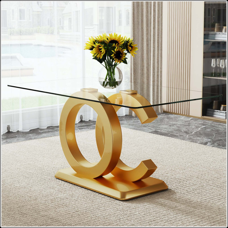 Table de salle à manger rectangulaire en verre avec base dorée en forme de CO