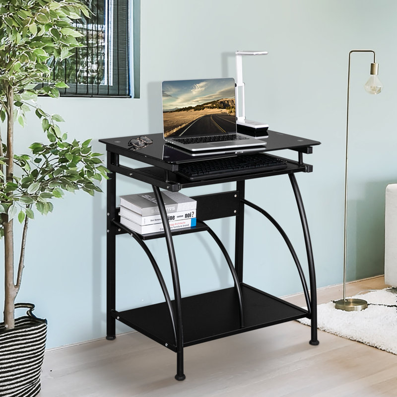 Bureau d'ordinateur moderne en verre noir avec cadre en acier et plateau à clavier