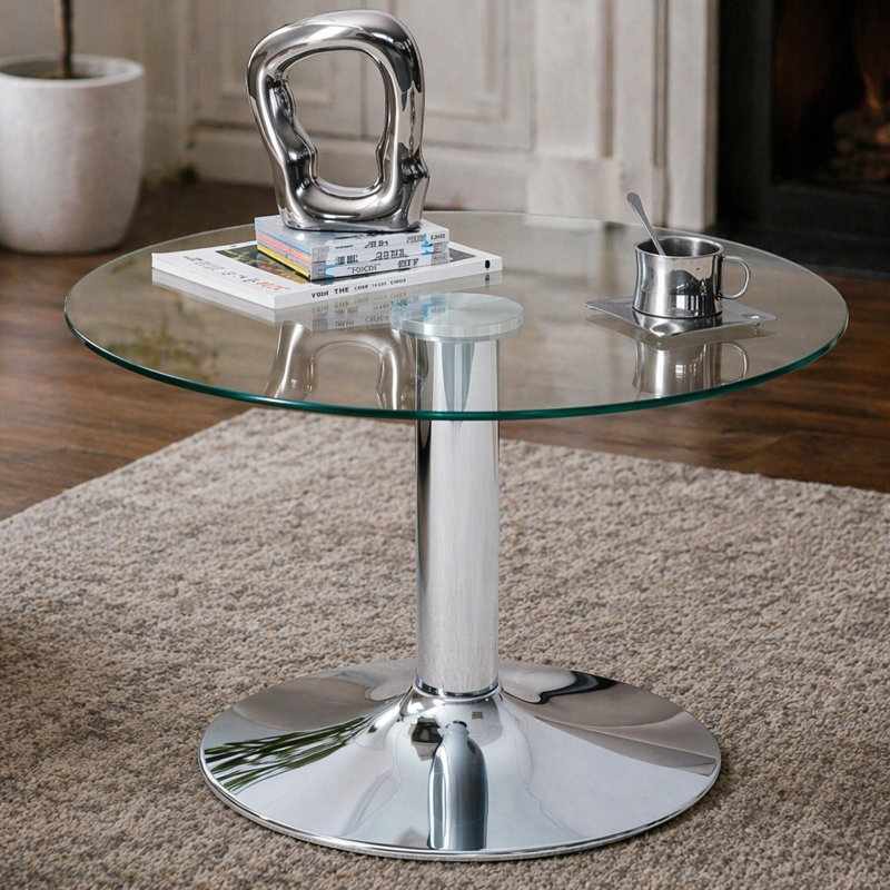 Table basse ronde en verre trempé de 27,5 pouces de diamètre. 17,7 pouces de haut, soutenu par une base en métal argenté, avec un bord de luxe léger.