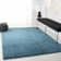 Tapis turquoise à longs poils