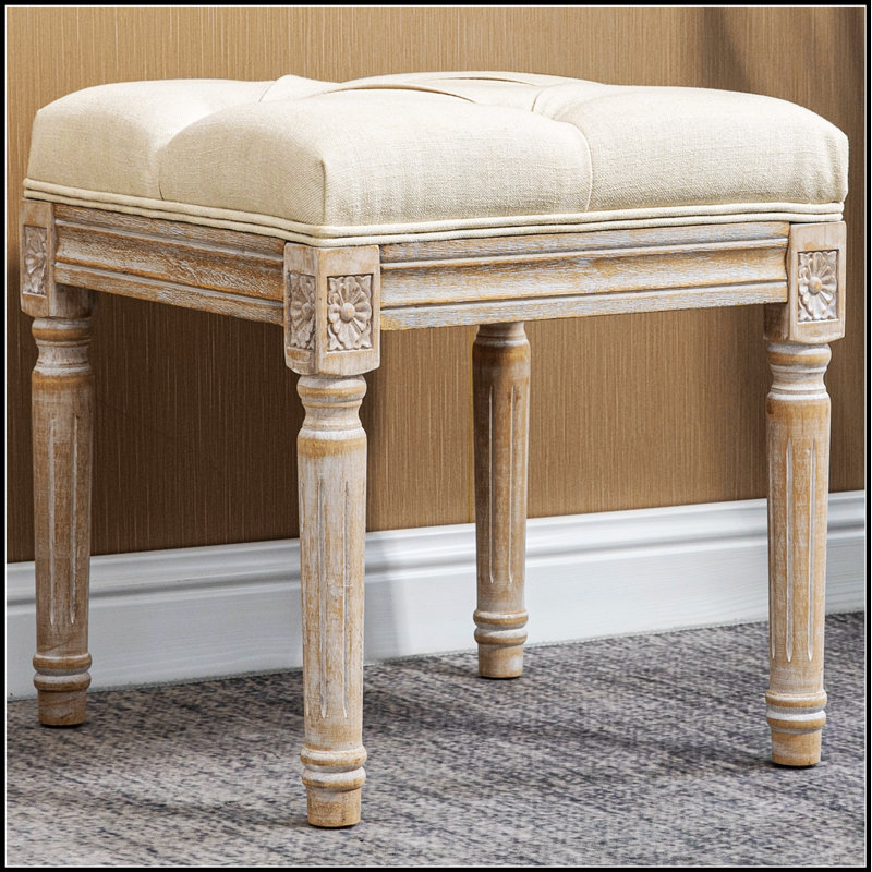 Repose-pieds capitonné rétro avec siège rembourré et pieds en bois rustique, parfait pour la chambre à coucher et le salon