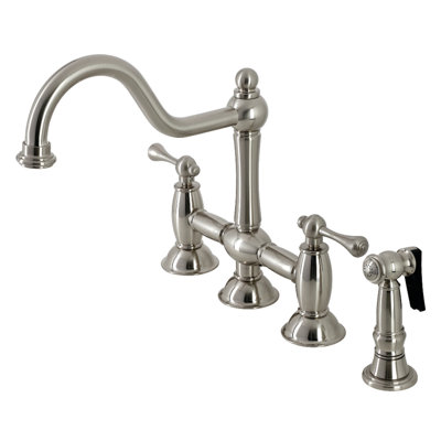 Kingston Brass Restoration Two-Handle 4-Hole Deck Mount Bridge Kitchen Faucet with Brass Side Sprayer