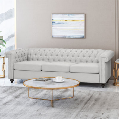 Sione 83" Upholstered Chesterfield Sofa Bring home a timeless addition to your living room with our lasting Chesterfield-style sofa