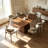 Brown Curved Solid Wood Dining Table