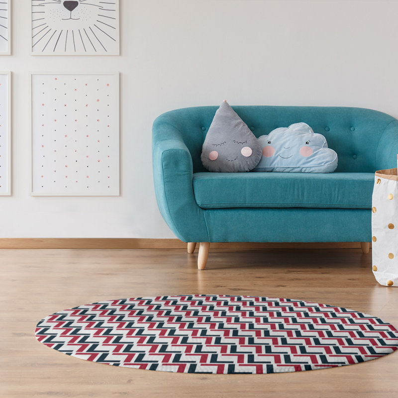 Tapis rond noir / rouge à motif géométrique