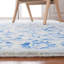 Tapis bleu / beige en laine touffeté à la main Maniscalco-804900766