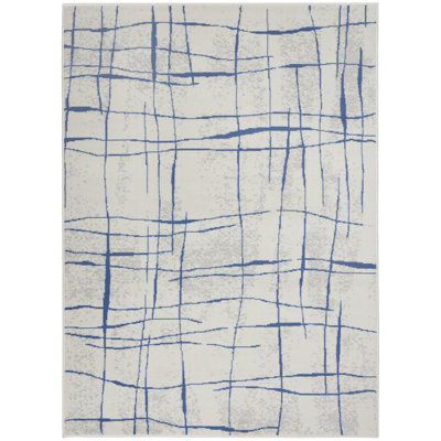Tapis abstrait ivoire en polypropylène tissé à la machine