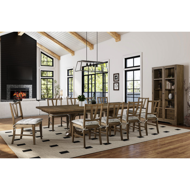 Table à tréteaux au fini amande, extensible de 213 à 290 cm, plateau à motif géométrique, placage, piètement en bois massif, largeur 112 cm, hauteur 76 cm, poids du placage : 104 kg