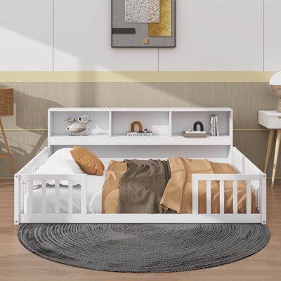 Full-Size Floor Bed Paired With A Bookcase And Additional Shelves