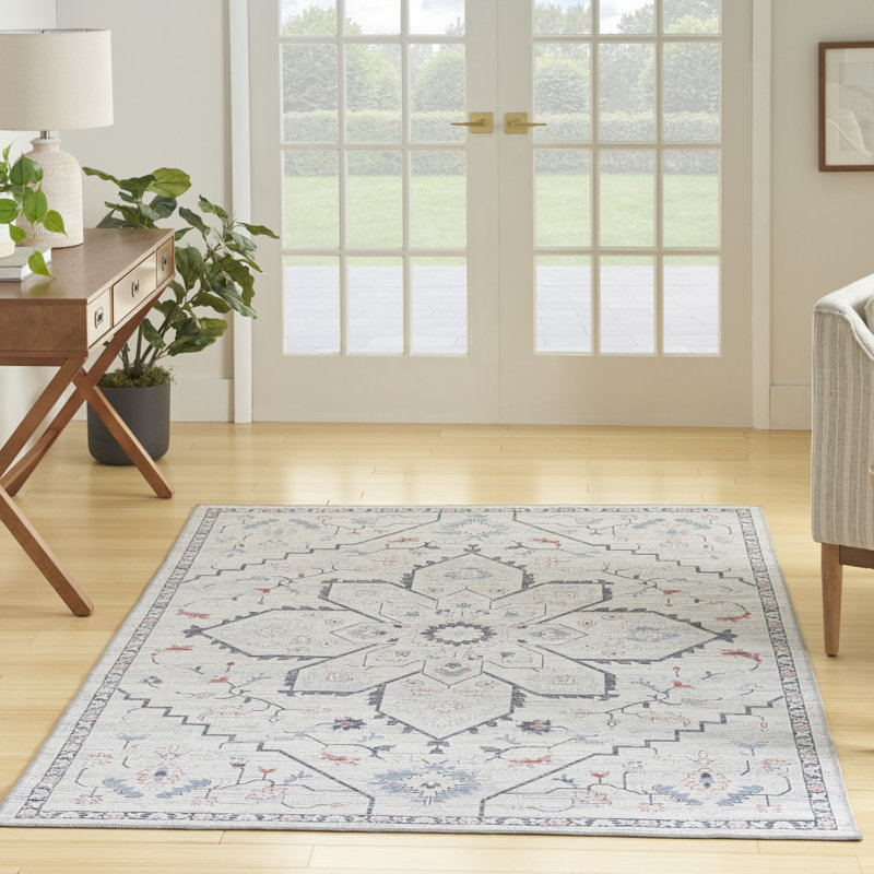 Tapis oriental ivoire et bleu tissé à la machine 6 pi x 9 pi