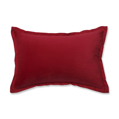 Coussin en velours à bride rouge