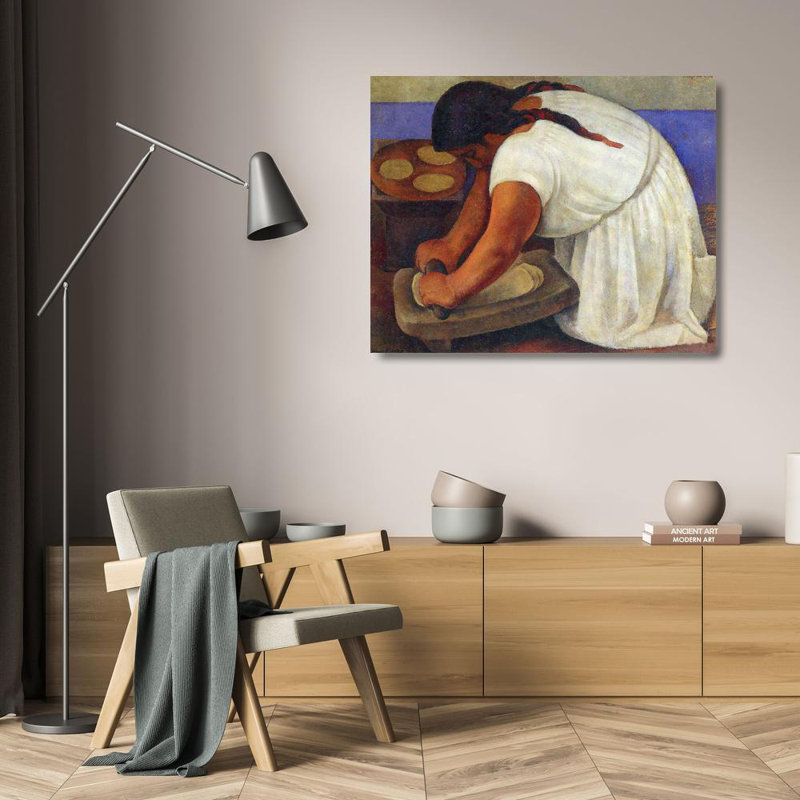Femme moulant du maïs, H 19 po x l 24 po