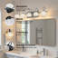 Éclairage pour salle de bain 29 po à 5 lumières noir mat et métal avec abat-jour en verre transparent pour la salle de bain (ampoules non incluses)-118588137-109616273