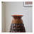 A 39-inch tall hand-woven bamboo floor vase - a decorative highlight for the living room, foyer or corridor - a versatile home decor item suitable for dried or silk flower arrangements.