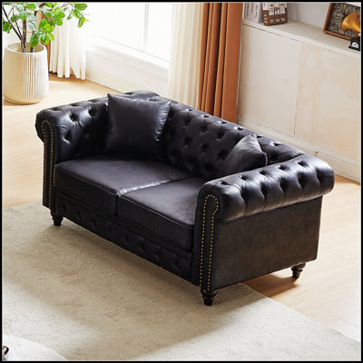 Luxueux canapé modulaire capitonné avec un revêtement de haute qualité et des pieds en bois robustes pour plus de confort et de style.