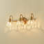 Luminaire pour meuble-lavabo en laiton antique à 3 lumières Kella, verre transparent Lotus, base E26, fixation murale pour salle de bain
