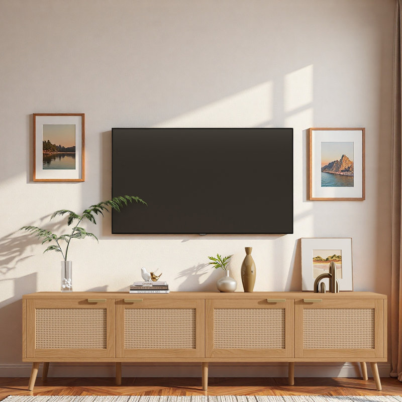 Meuble télé moderne avec portes en rotin, armoires de rangement et trous pour câbles
