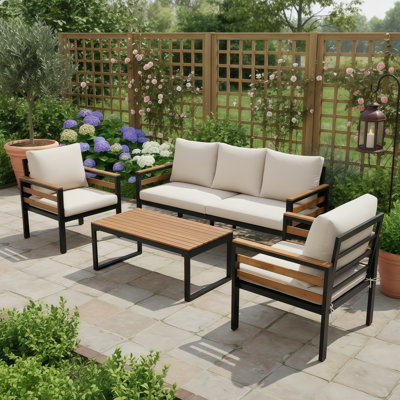 This Premium Outdoor Sofa Set (4 Pieces) Offers A Spacious Layout That Seats 5 People. Features Include Acacia Wood Armrests, A Solid Wood Table, And Easy-To-Wash, Upholstered Beige Cushions. Perfect For A Stylish And Relaxing Patio Setting.