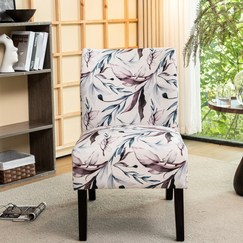Fauteuil en tissu imprimé avec motif floral mauve - Espace de vie moderne, assise confortable et sans accoudoirs