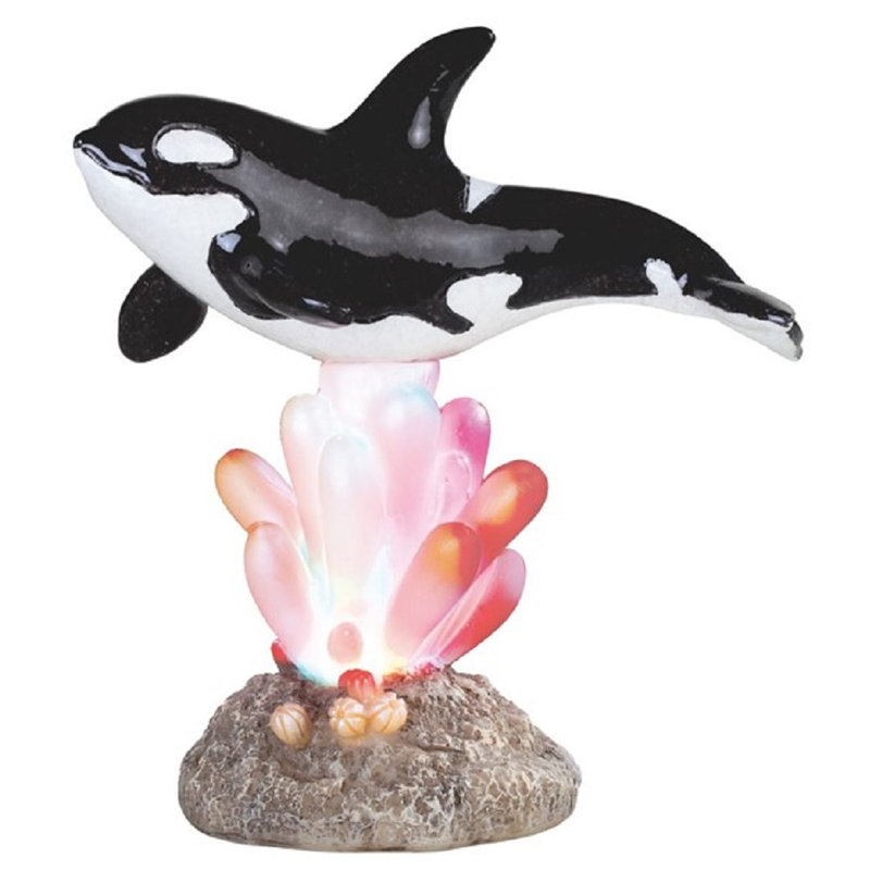 La baleine sur le corail avec lumière del de nuit