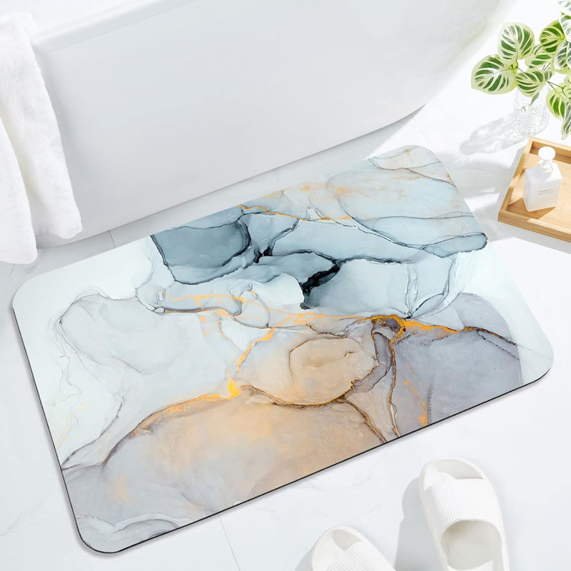 Tapis de bain ultra-absorbant à séchage rapide et fin, se glisse sous la porte, antidérapant grâce à son dos en caoutchouc, idéal devant la baignoire, le lavabo et la douche.