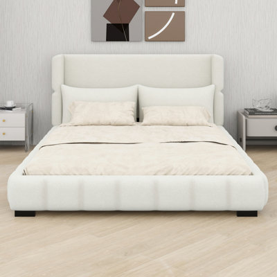 Lit plateforme tapissier avec deux coussins assortis, élégant et confortable