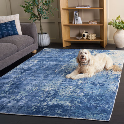 Tapis bleu / blanc à motif abstrait Mcelroy