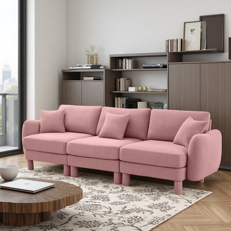 Canapé à 3 places en tissu Boucle avec accoudoirs distinctifs en forme de coquillage, pieds cylindriques enveloppés de tissu d'ameublement