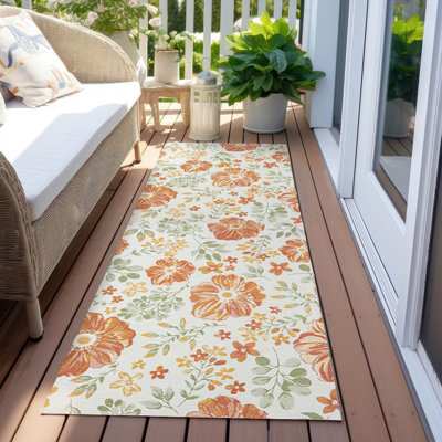 Tapis orange / ivoire à motif floral tropical intérieur / extérieur Lylliana