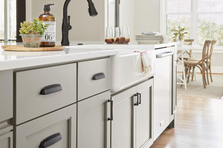 modern farmhouse kitchen with gray cabinets and matte black metal drawer pulls