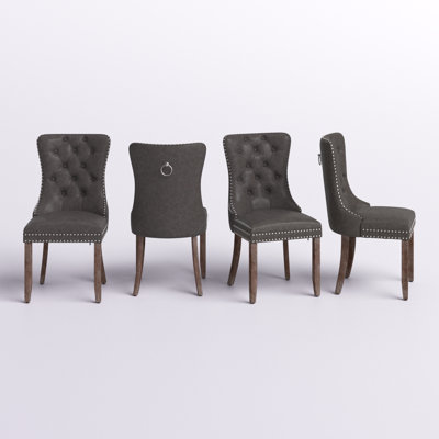 Alexes Tufted Leather Upholstered Wing Back Dining Chair Featuring Water And Stain Resistance