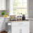 White Multifunctional Kitchen Trolley Comes With Storage Drawers Enclosed Cabinet And Exterior Towel Holder