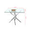 Table carrée contemporaine en verre trempé transparent avec pieds élégants en acier inoxydable à finition argentée, parfaite pour les intérieurs modernes et les espaces compacts.