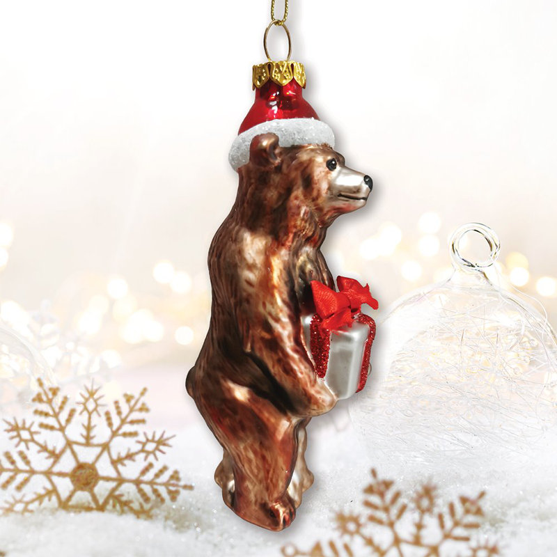 Ornement de Noël grizzly avec chapeau de père Noël et verre de cadeau