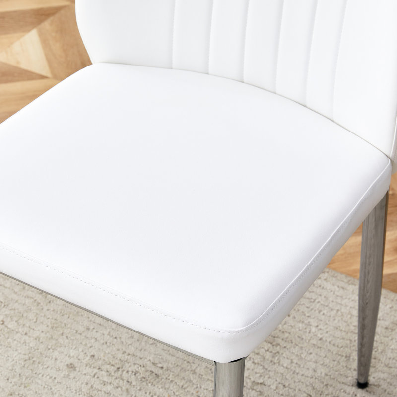 Table en verre trempé et 4 chaises en polyuréthane avec pattes de protection en métal argentées à 7 pattes, instructions d'assemblage faciles incluses