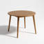 Table de salle à manger ronde en bois massif avec plateau à lattes, fabriquée en bois franc durable avec une finition chaude et des pieds fuselés modernes