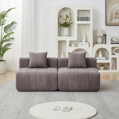 sectional sofa with 2 pillows