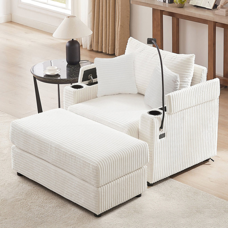 Canapé beige avec options de rangement et mobilité. Mobile, 2 ports, porte-gobelets, porte-téléphone. Épais. Velours côtelé, siège de soutien