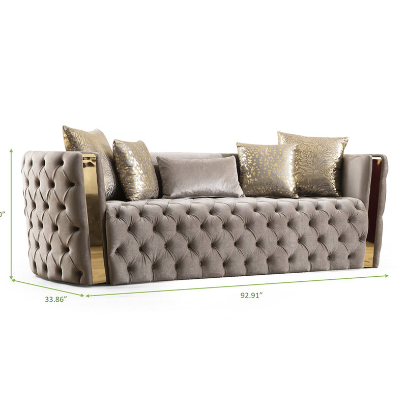 Velours taupe avec capitonnage à boutons et coussins dorés