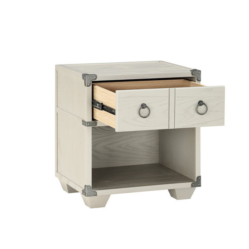 Table de chevet grise avec des matériaux et une touche moderne dans un mouvement de pieds lisse