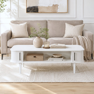 Table basse Aguilera de 47,2 po avec rangement et porte coulissante cannelée