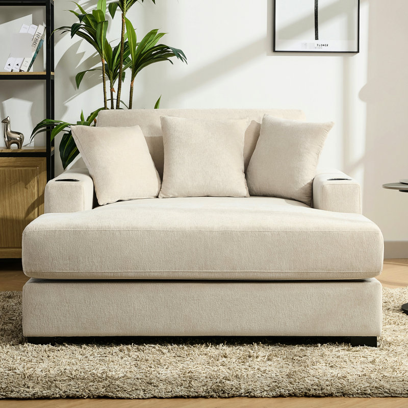 Chaise longue moderne de 140 cm avec revêtement en chenille crème, poste de charge et porte-gobelets pour des fins de semaine de détente dans des espaces de vie confortables.