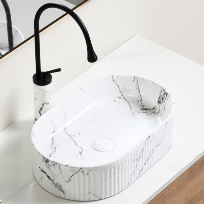 Vasque ovale de salle de bain 19x12 pouces en porcelaine céramique effet marbre noir et blanc, avec robinet à motif unique, cuve lisse à bulles, bonde en céramique.