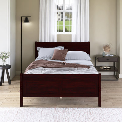 Lit plateforme en bois avec tête de lit