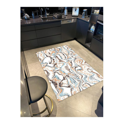 Tapis tissé à motif flou et base lavable