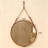 Brown circular hanging mirror